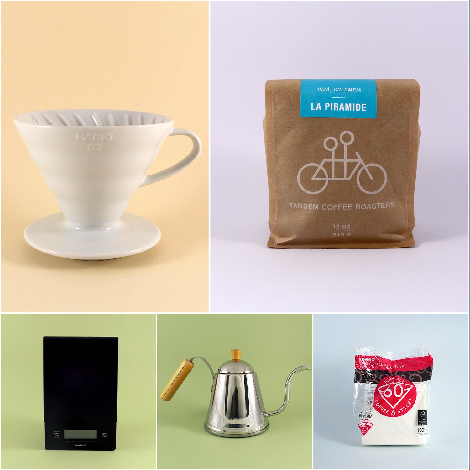 Image showcasing the V60 Starter Kit by Tandem Coffee Roasters: a white Hario V60 dripper, a brown bag of La Piramide coffee beans, a black coffee scale, a silver gooseneck kettle, and a pack of Hario 02 white coffee filters.