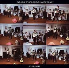 A collage shows a band performing live with instruments and microphones. The top text says, The Name of this Band is Talking Heads. At the bottom: Live 2 CD Set. Product: Talking Heads - The Name of this Band is Talking Heads by Tandem Coffee Roasters.