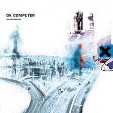 Album cover for Radiohead - Ok Computer by Tandem Coffee Roasters features abstract, blue-toned highway art with blurred figures and fragmented “Airbag” text on a mainly white background.