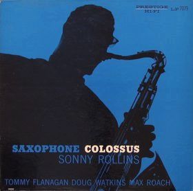 Album cover for "Sonny Rollins - Saxophone Colossus" by Tandem Coffee Roasters, showcasing a blue silhouette of a man playing a saxophone. The text includes the album title and the names "Sonny Rollins," "Tommy Flanagan," "Doug Watkins," and "Max Roach" in white and yellow letters, with hints of tracks like "Blue 7.