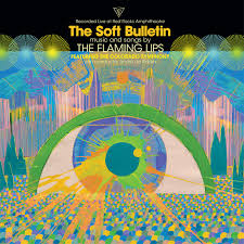 Psychedelic album cover for Flaming Lips - The Soft Bulletin - Live at Red Rocks featuring the Colorado Symphony by Tandem Coffee Roasters, with a large eye and vibrant abstract patterns inspired by Yoshimi Battles the Pink Robots.
